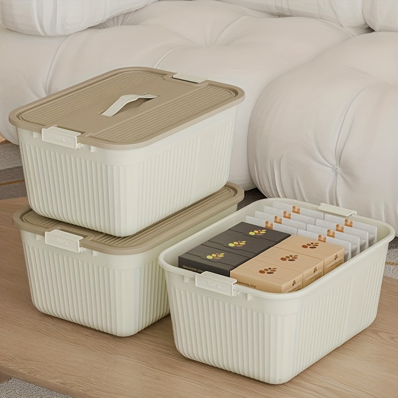 three lidded plastic storage boxes stackable organizing containers with snap seals and handles suitable for home storage for in closets kitchens bedrooms and living rooms in cream yellow measuring 38 5 28 5 18 5cm Product details 1