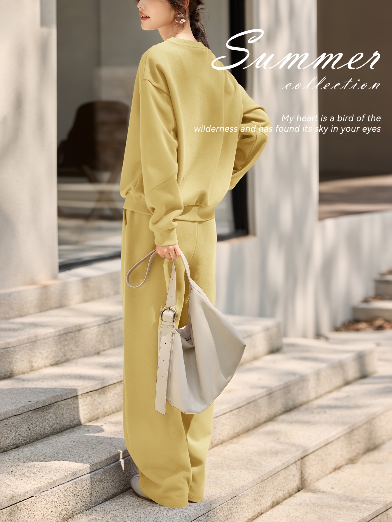 Close-up of the embroidered letter detail on the sweatshirt