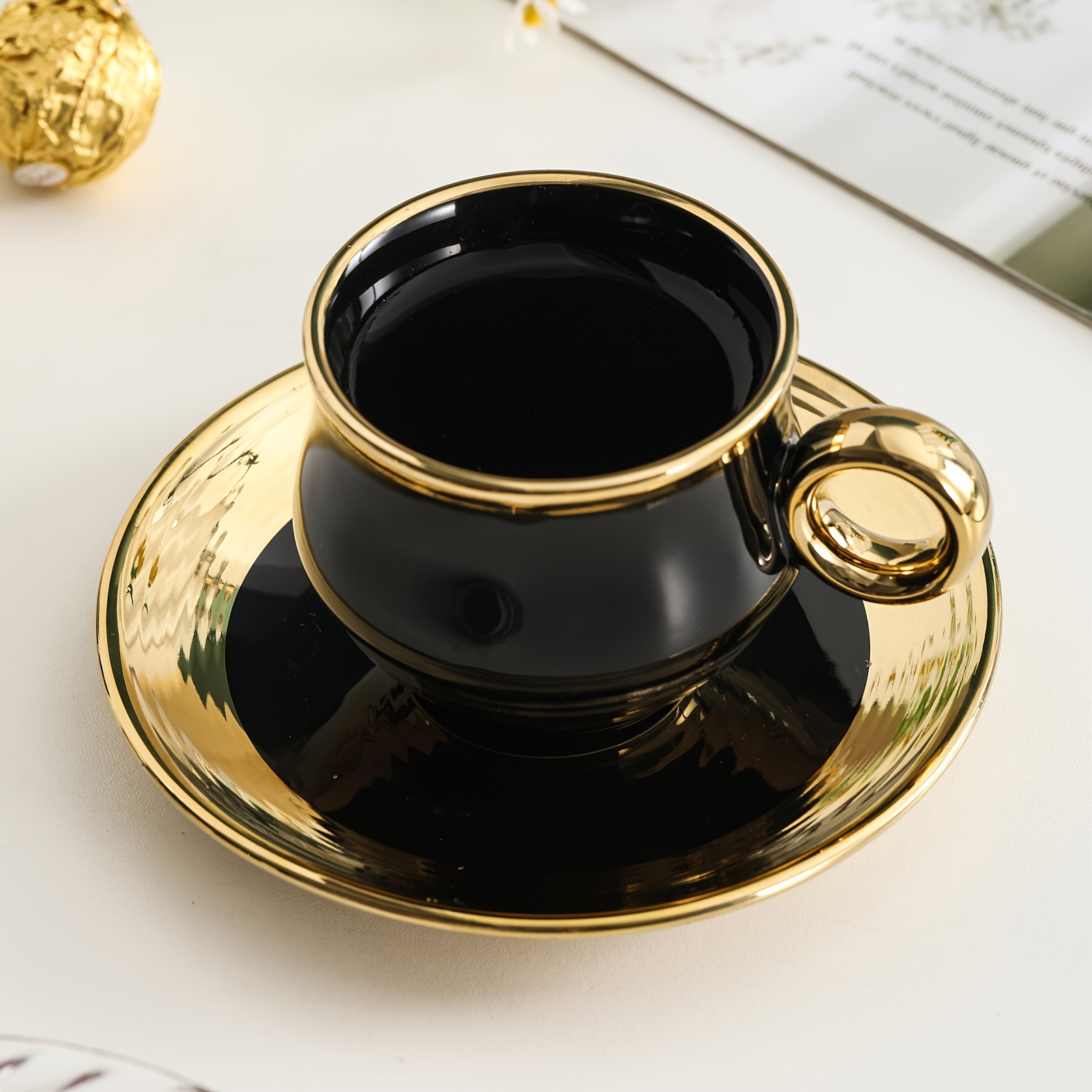 elegant gold trimmed black ceramic coffee cup and saucer set hand wash only bpa free microwave safe insulated easter theme reusable graphic pattern oval shaped multipurpose use for cold beverages ideal for adults luxury business gift 6 cups 6 saucers 150ml 5 29oz details 5