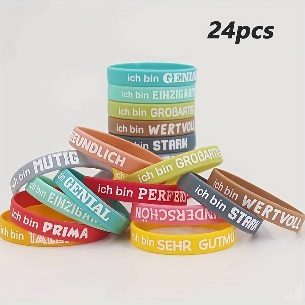 Image of 24pcs Silicone Wristband Set With Motivational German Quotes, Featuring Inspirational Phrases For Daily Self-encouragement And Friendship Accessories. Colors And Lettering Are Random