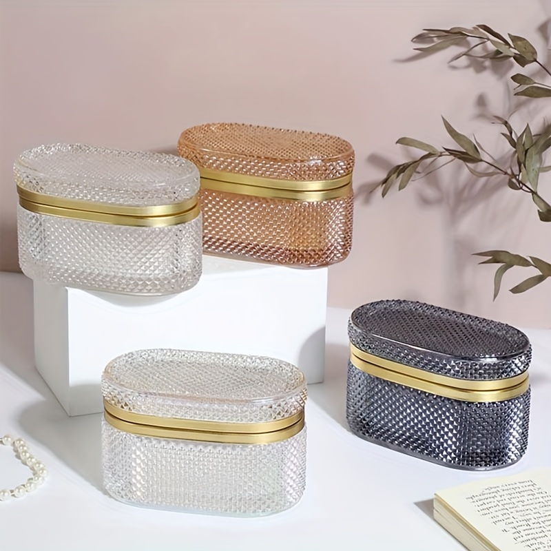 modern clear glass storage box with golden accent lid dustproof oval desktop organizer for jewelry makeup pads and accessories polished   multi purpose   metal interior no power needed makeup storage contemporary style textured glass jewelry boxes Product details 1