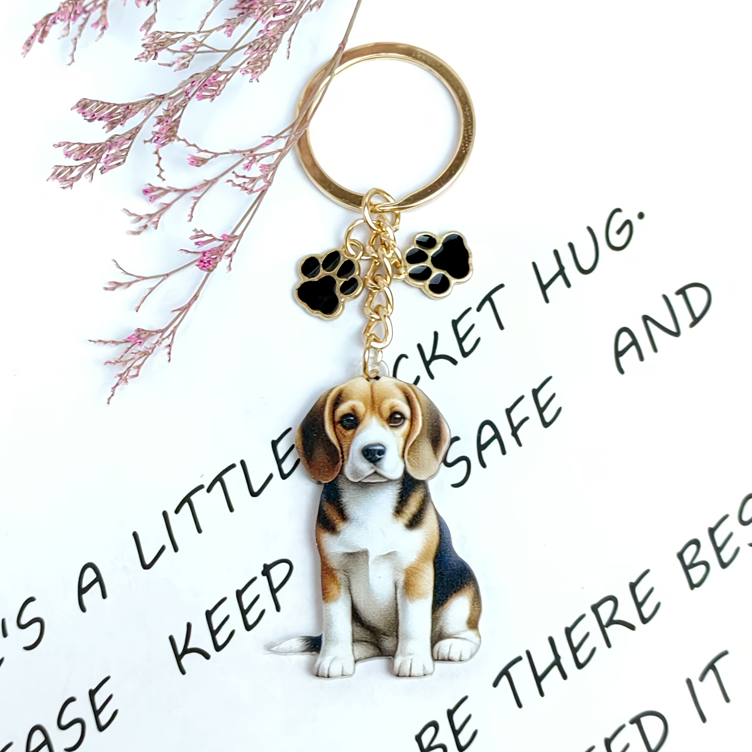 Image of A Cute Little Dog With Black, Yellow, And White Colors Sits Down, Perfect For Use As A Keychain, Bag Clasp, Or Car Keychain Accessory, Making It An Ideal Gift For Dog Lovers