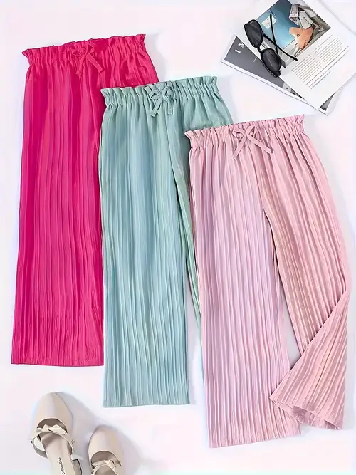 SHEIN Meisjesbroek met elastische taille en print en strepen aan de SHEIN Meisjesbroek met elastische taille en print en strepen aan de