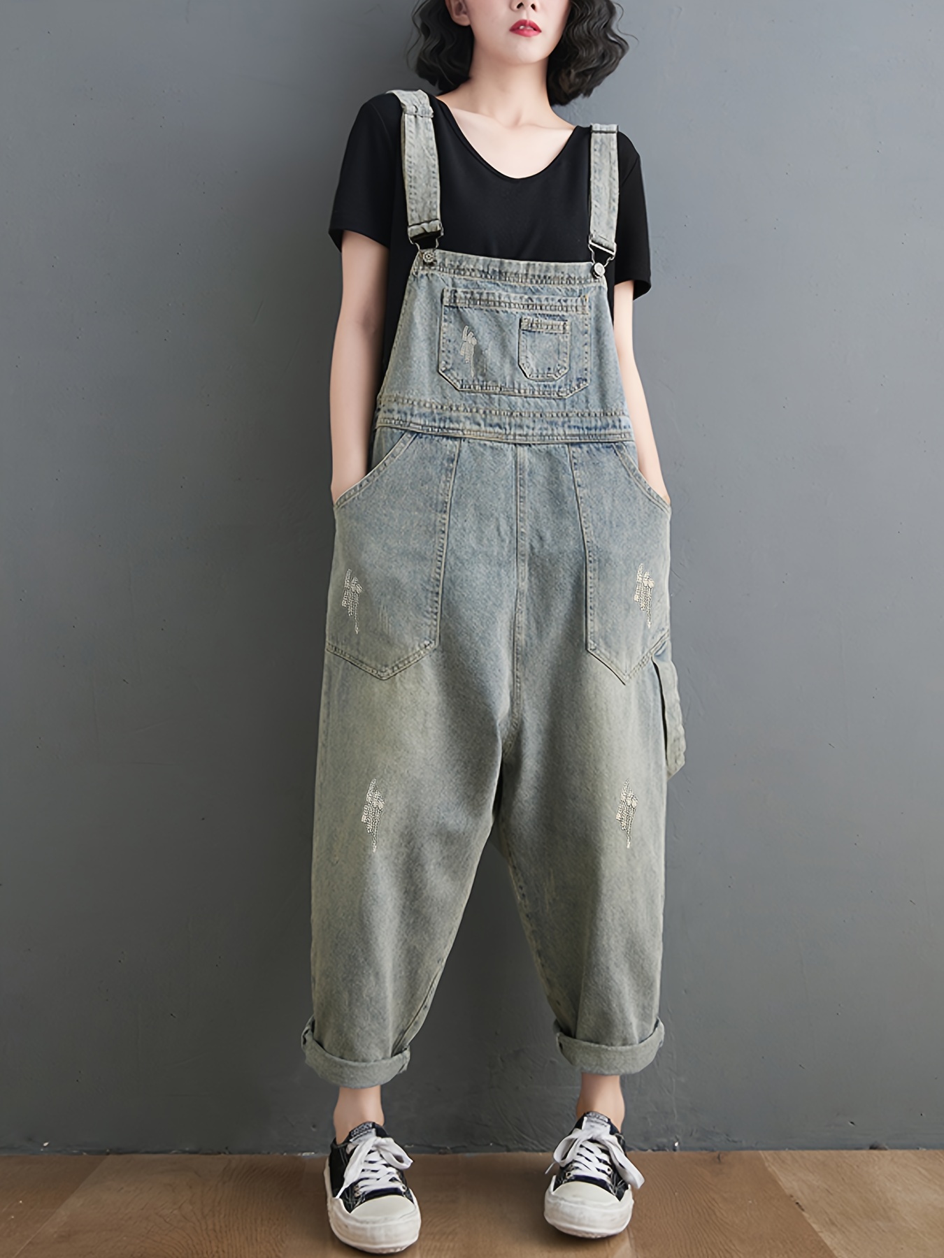 item picture   a pair of cropped pants with a loose fit featuring adjustable sleeveless straps   womens denim overalls are suitable for   offering a stylish and look