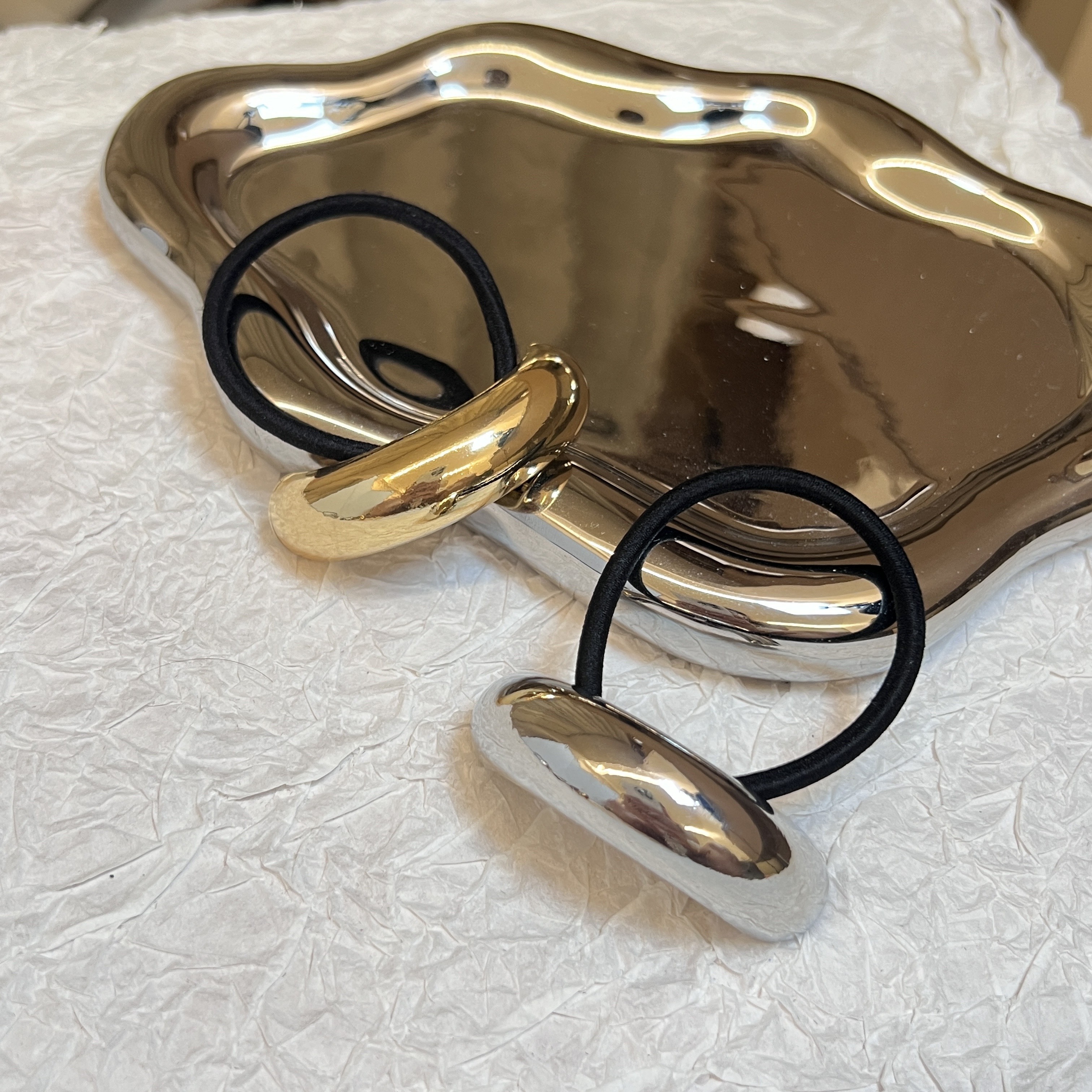 

Set Of 2 Hair Ties In Cool- Mirror-like Golden And Silvery, Featuring A Golden Half- Ponytail Holder. A Simple And Elegant Ponytail Hair Accessory.