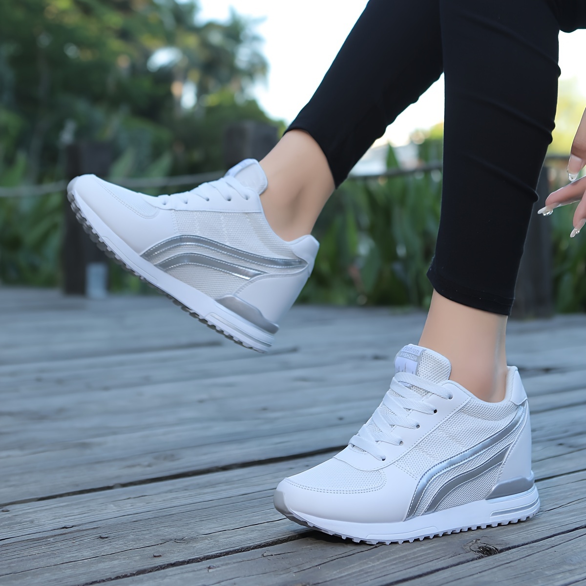 White ladies wedge sneakers sold by 100 Spartans