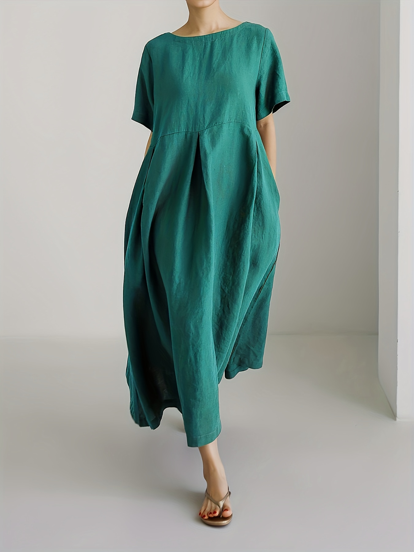 plus size a loose fitting solid color maxi dress for women   and summer featuring short sleeves a round neckline and casual pockets 3