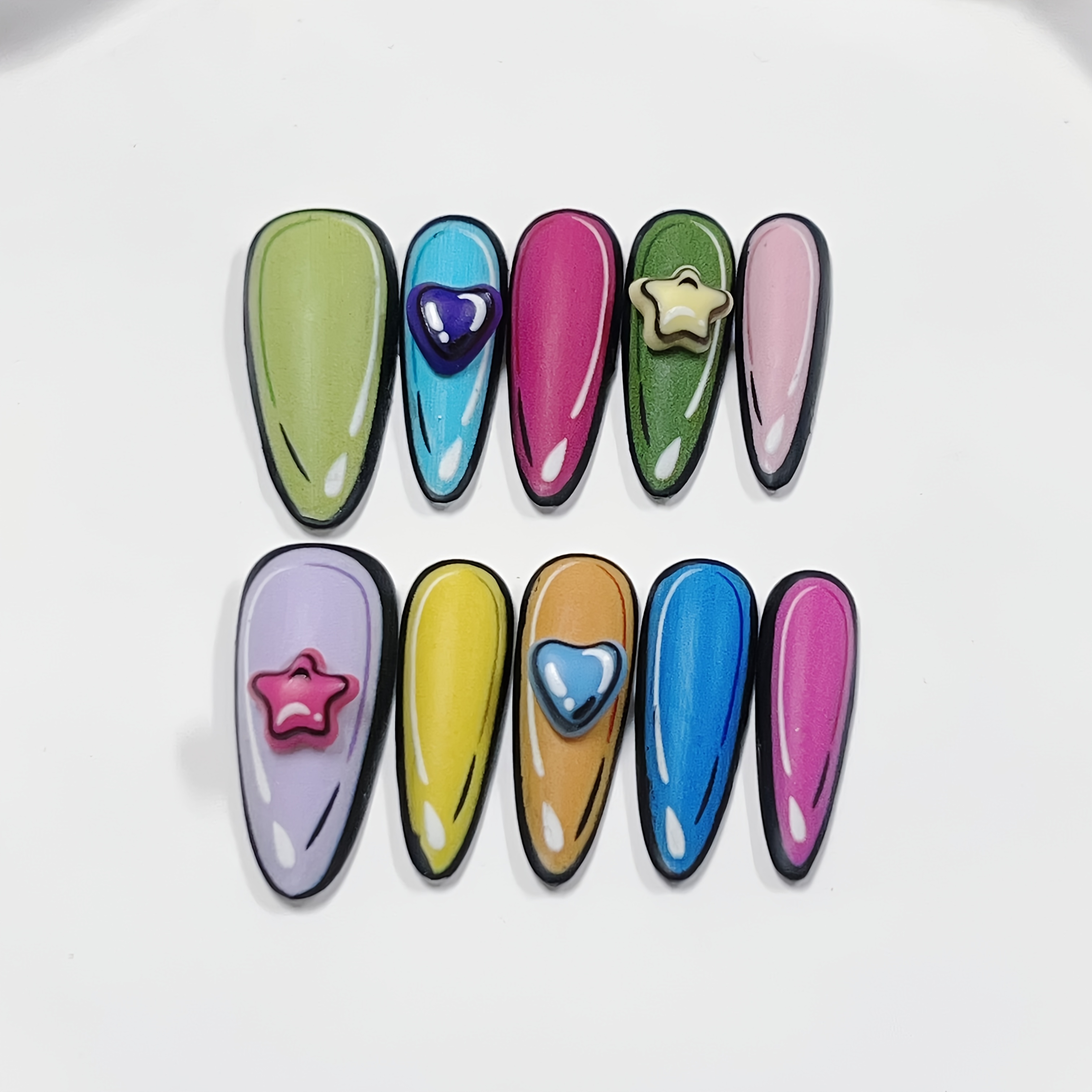 A Set Of 10 Long Almond-shaped Matte Nail Stickers Featuring A Two-dimensional Comic Style, Designed With 3d Heart-shaped Pentagrams In Of Sweet And Including Blue, Pink, Green, Yellow