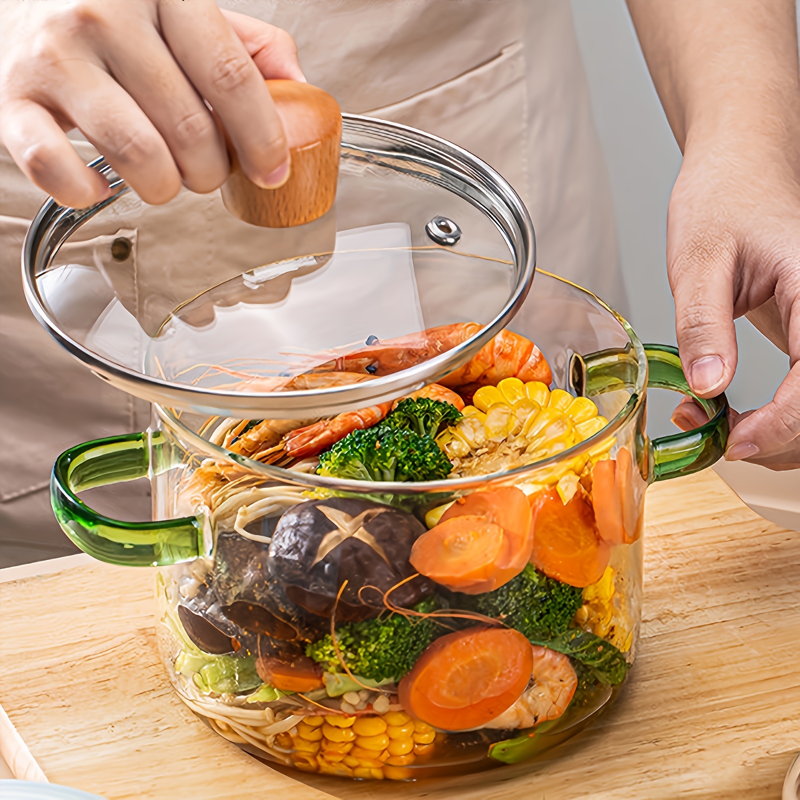 

Borosilicate Glass Cooking Pot With Wooden Lid - Heat-resistant & Easy To Clean, Soup, Milk, Noodles | Transparent With Green Handles, Ideal For Home & Restaurant Use