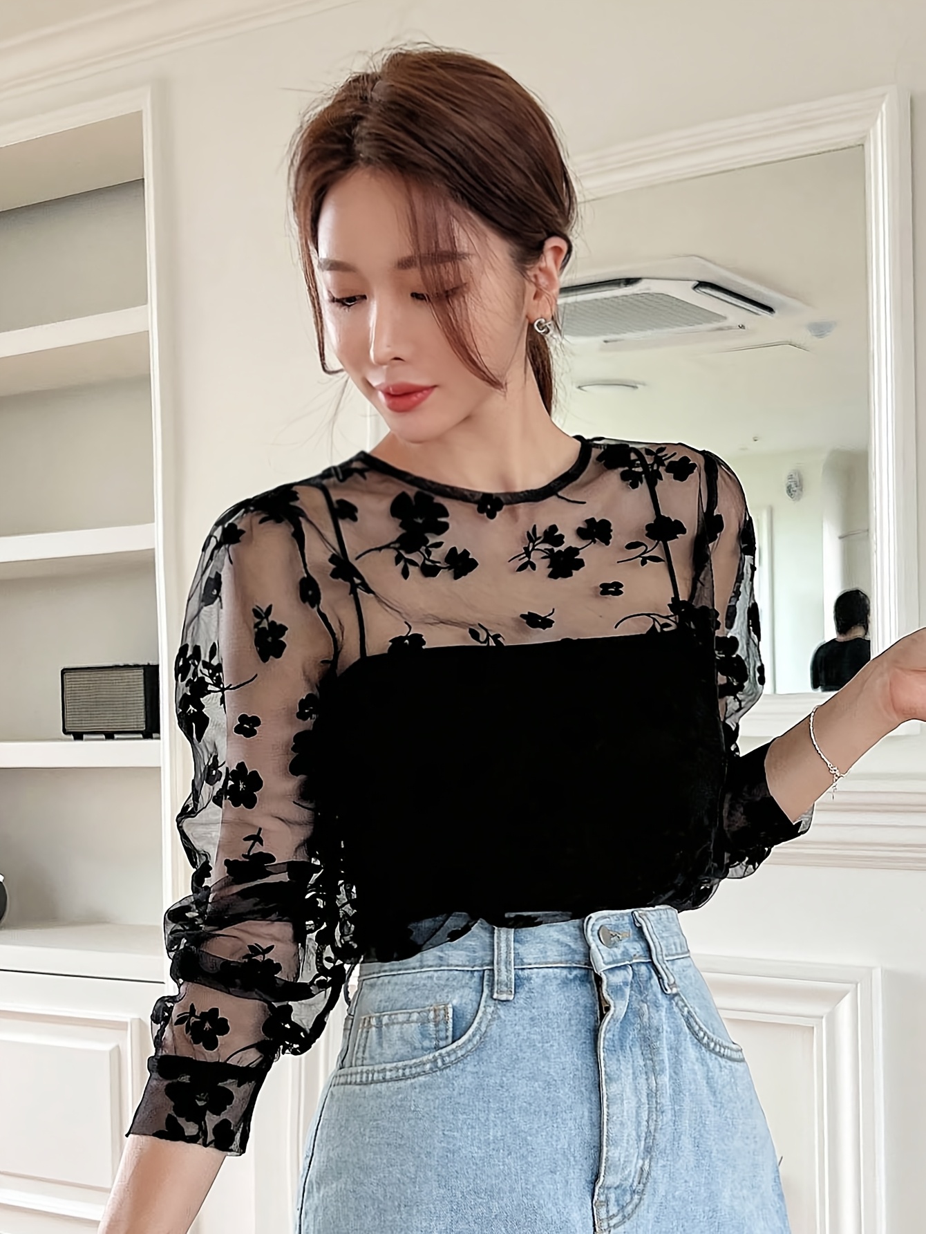 sheer black top with floral embroidery