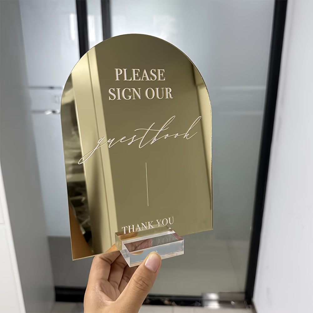 E-shop 2D Flach, Individuelles Gewölbtes Acryl Hochzeitstischschild mit Goldener Spiegeloberfläche Schwarzem/Klarer Stütze "Bitte unterschreiben Sie