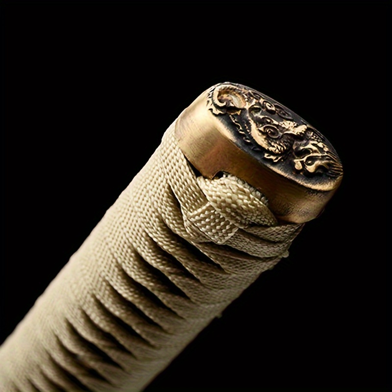 The handle of an antique Japanese Samurai Katana Sword sold 100 Spartans