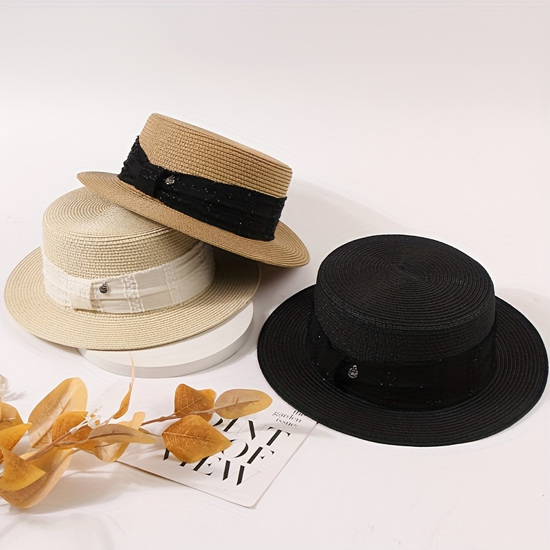 

Summer Sun Hat With Elegant Woven Ribbon And Small Metal Emblem, Versatile Panama Hat For Beach And Travel, Straw Hat