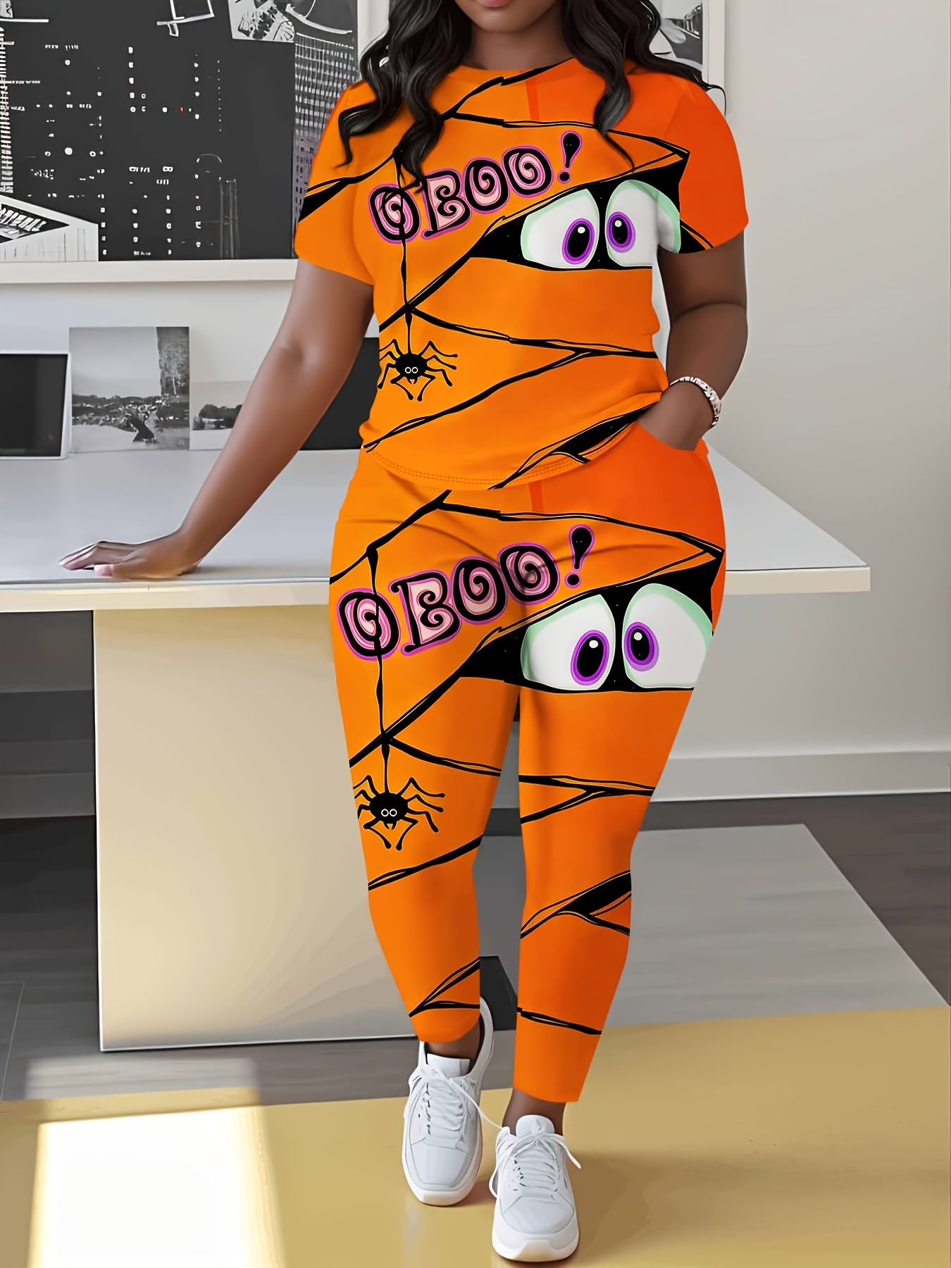womens two piece set featuring a printed short sleeve t shirt and trousers     neck top and pants with a fun   bandage graphic suitable for casual and athletic wear holiday parties and halloween costumes