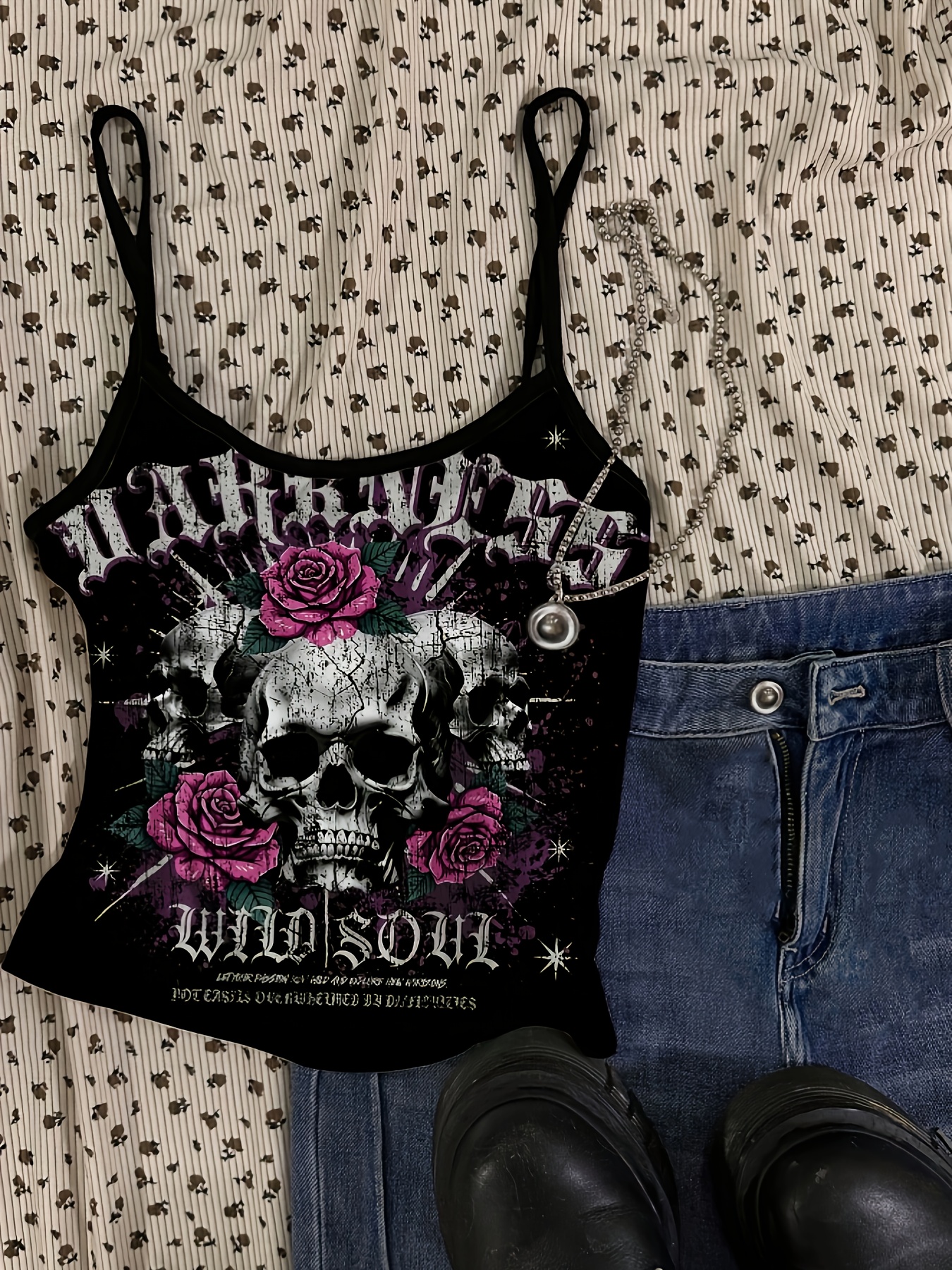 directional dark-themed sleeveless tank top with skull print and