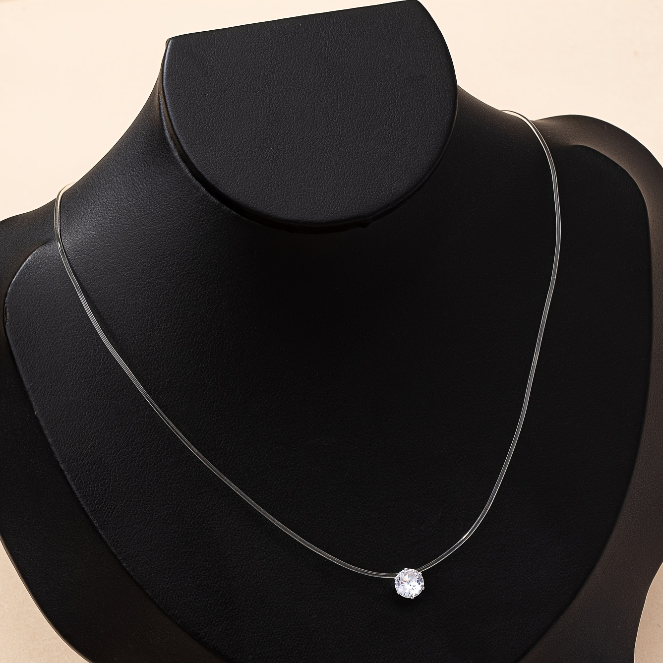 A Women's Fashion Pendant Necklace With Round Synthetic Zirconia, Featuring A Transparent Fishing Line Chain. This Elegant, Simple, And Versatile Piece Of Jewelry Is Suitable For Daily Wear