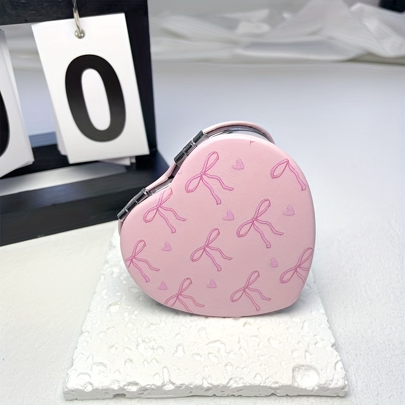 Image of A Heart-shaped Pu Bow With Heart Print Mirror, Compact And Portable For Easy Carrying, A Handheld Mirror For Girls To Touch Up Their Makeup