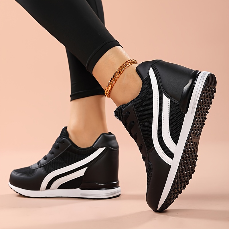 Black ladies wedge sneakers sold by 100 Spartans