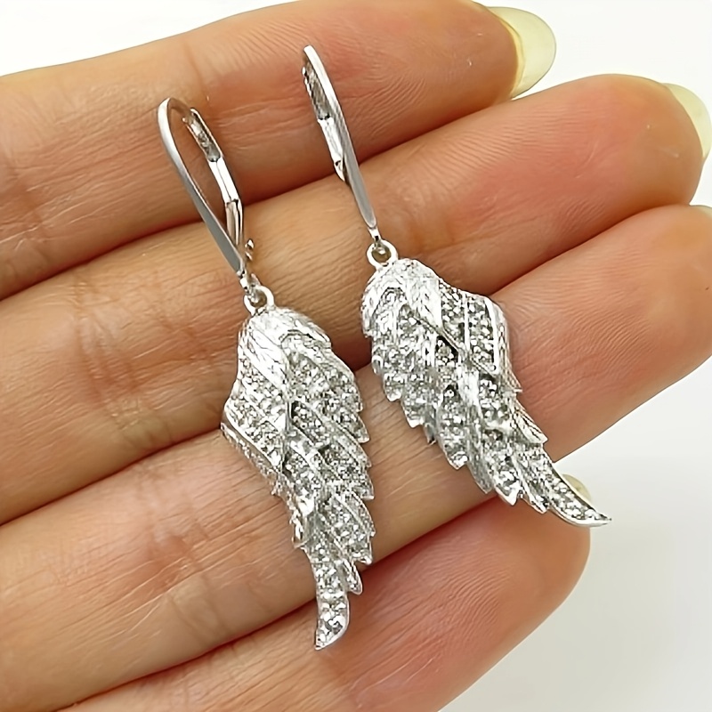 

A Pair Of Ladies' Stylish Earrings With Unique Creative Of Synthetic Zirconia Wing Earrings For Ladies' Banquet Party Casual Jewelry Accessories.