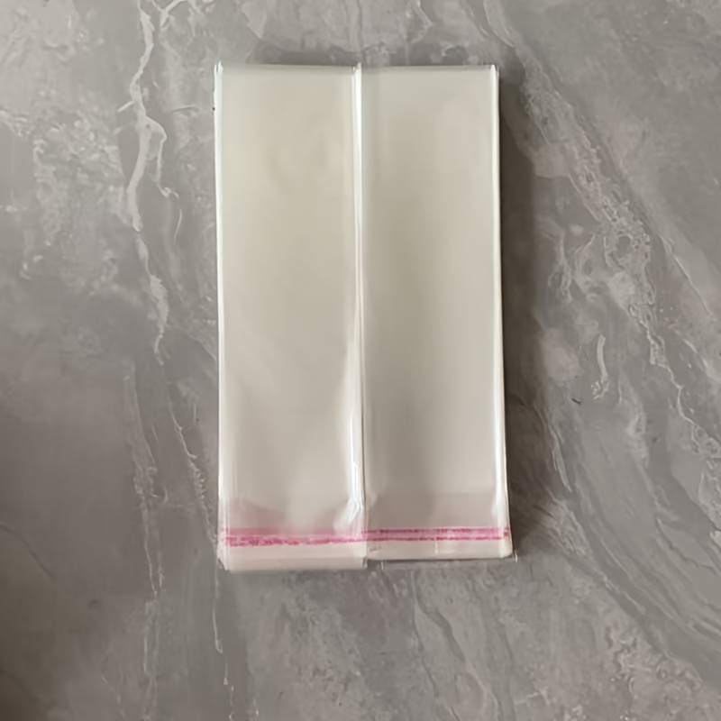 E-shop 100 Stück Packung Flecken- Sandfeste Transparente Wiederverwendbare Plastiktüten mit Bindeverschluss – Lange Streifen OPP/Glas-Papier