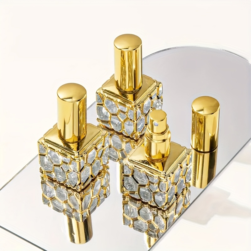 set of 5 arabic luxury perfume samples in golden and silver travel sized glass bottles featuring a fine mist spray designed for   for gifting portable for purses and ideal for weddings parties and festivals