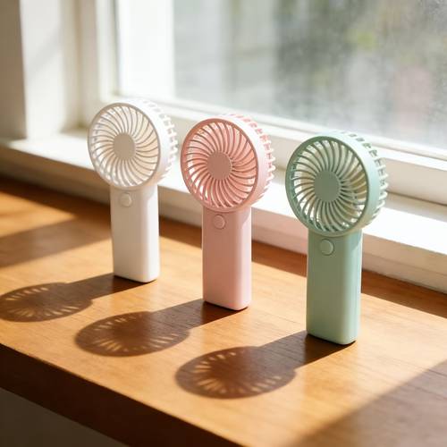 item picture mini handheld fan portable battery powered for cooling anywhere ideal for office outdoors travel and camping batteries sold separately