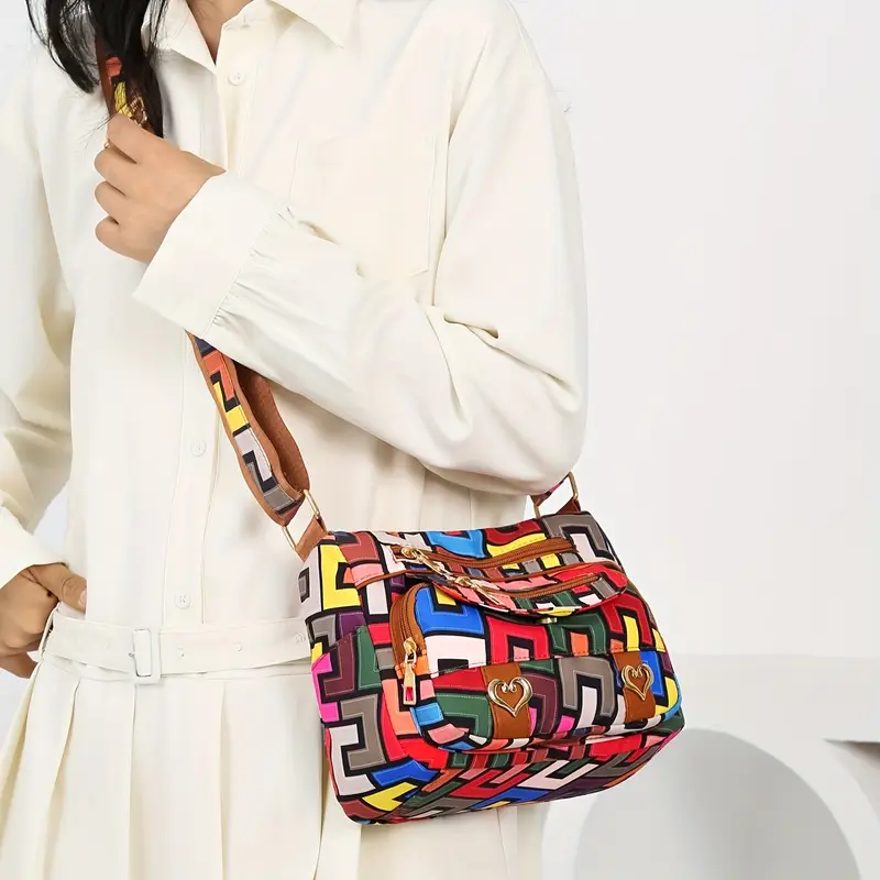 colorful geometric hip hop style womens crossbody bag large capacity with multiple pockets durable nylon vibrant red with brown accents zip closure details 4