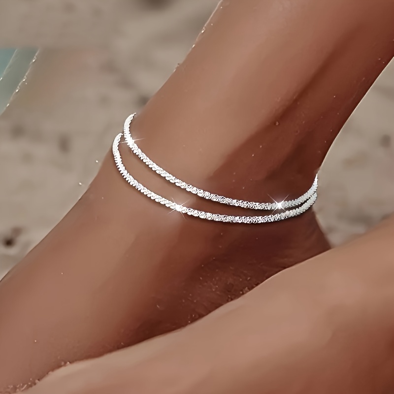 Image of A Silvery Anklet For Women. An Ideal Gift For . Perfect For Daily Commutes, Summer Beach Parties, And Vacation Wear