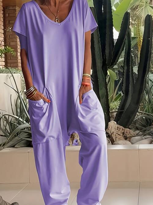 a womens loose fitting romper with pockets in a single color