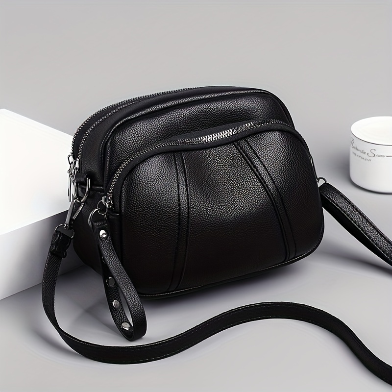 A Easy Solid Color Large-capacity Crossbody Bag, Featuring A Retro With Multiple Compartments For Shoulder Carrying