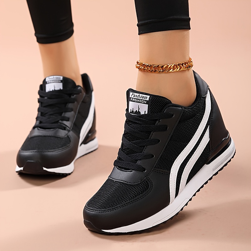 Black ladies wedge sneakers sold by 100 Spartans