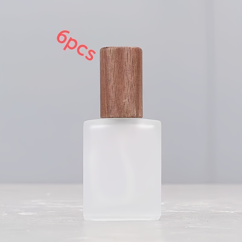 Image of 6pcs Set Of 15ml Screw-top Empty Perfume Bottles With Wooden Lids, Reusable For , Living Room & Bedroom Vanity Decor, High-end Glass Travel-friendly Bottles With Push-type Sprayers, Simple And Elegant