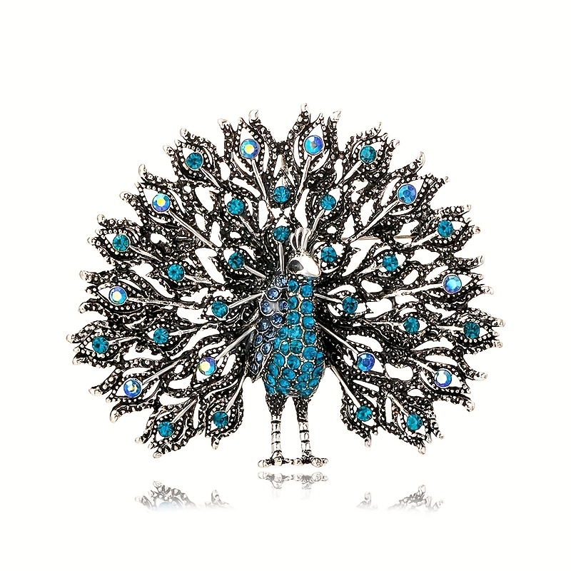E-shop Ein Vintage-Accessoire mit einer Anstecknadel in Form einer bunten Strass-Pfauen-Brosche