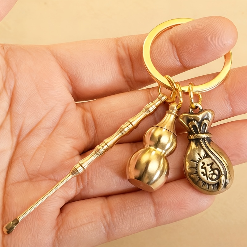 TEMU Set Of New Alloy Fashionable Brass-colored Keychain Wallet Charms, Featuring A Simple-style Openable Gourd-shaped Ear Pick Pendant. Suitable For