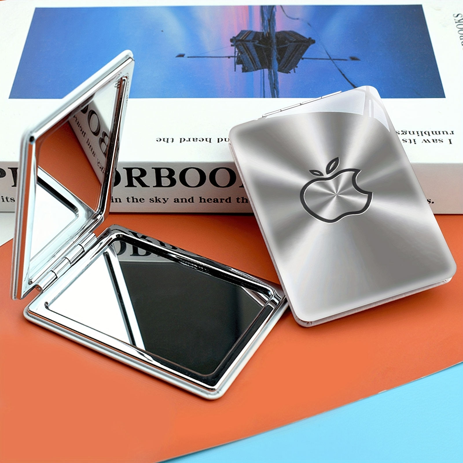 TEMU 1 Portable Makeup Mirror - Double-sided, Foldable, Handheld Design, Shiny Minimalist Logo On Silvery Background, Showcasing Tech Aesthetics And