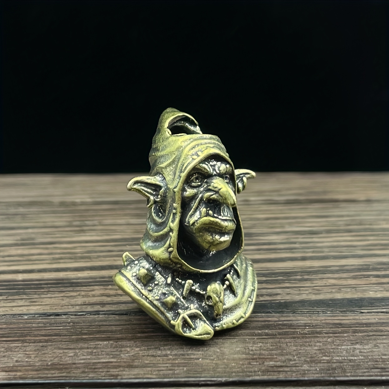 Image of Men's Key Ring And Keychain Featuring A Brass Goblin Charm With Long Ears And A Pointed Nose, Displaying A Mottled Of Oxidized Copper Resembling Rust. Its A Sense Of Mystery, Fitting For A Style