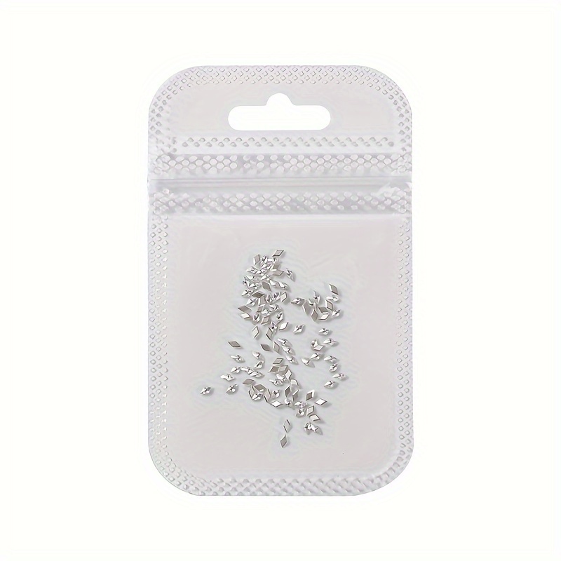 A Bag Containing 100pcs Of 1.5*3mm Glittering White Diamond-shaped Cubic Zirconia Nail Charms, Perfect For Bridal And Nail Decoration Additions