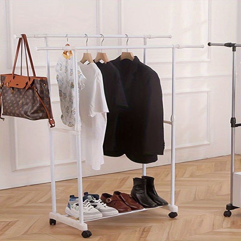 

Elegant Metal Clothes Rack With Wheels - Adjustable Height, Double Rod For Efficient Storage