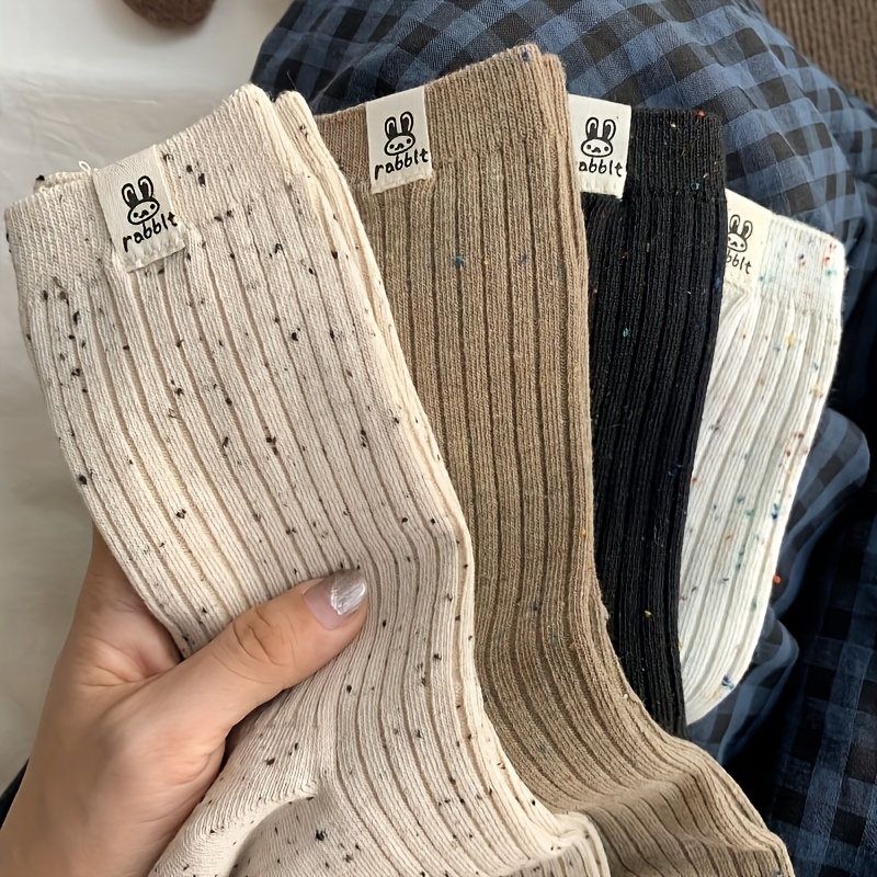 

4 paires de chaussettes pour femmes, mélange polyester et spandex, tissu tricoté, couleur unie, tube mi-haut décontracté avec étiquette lapin pour et l'hiver