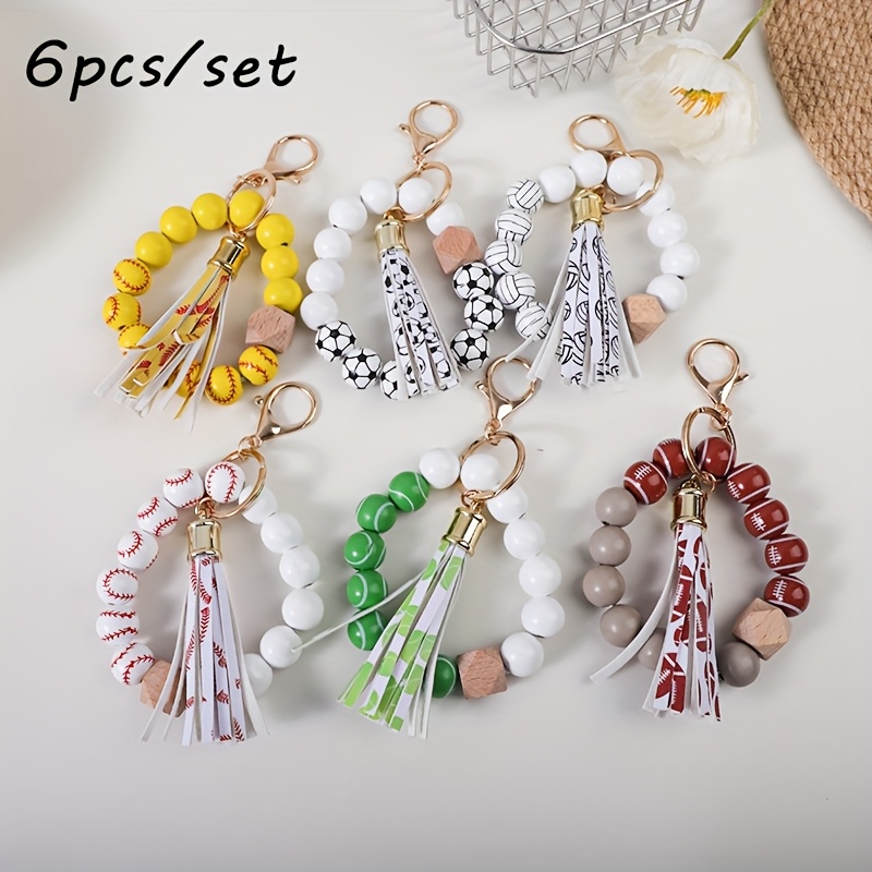 

6pcs/set Sports Bead Keychains With Tassels - Wooden & Leather Wrist Key Rings, Round Beaded Keychains With Lobster Clasp, Decorative Key Holders For Sports Enthusiasts, Gift