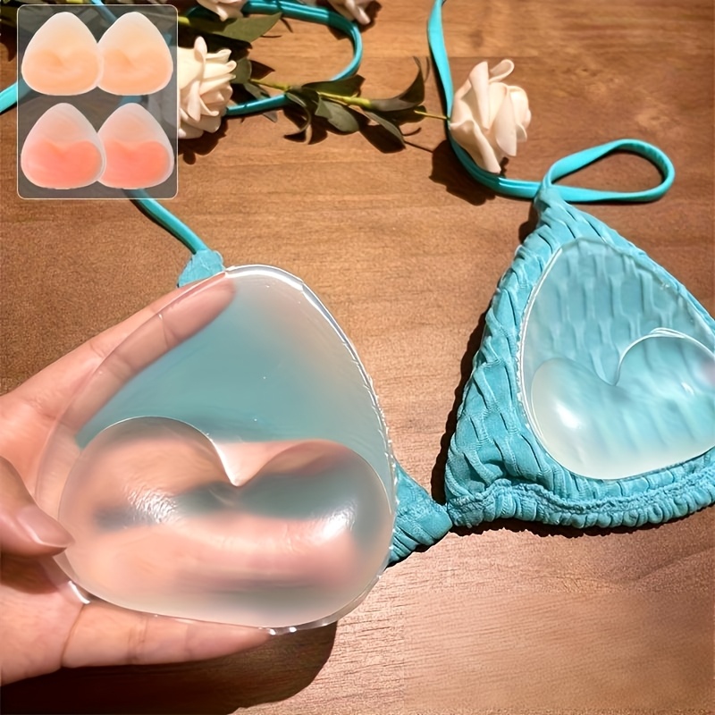 a set of silicone inserts for womens bras designed to enhance the bust with a triangular shape