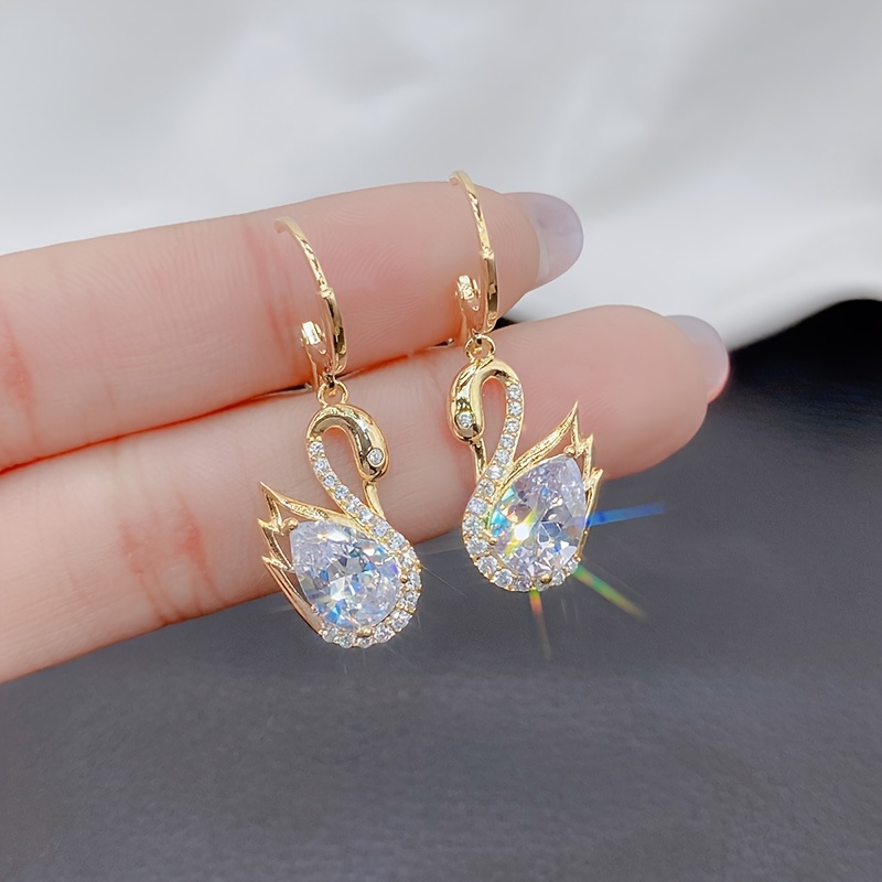 A Pair Of Earrings Shaped Like Little For Women
