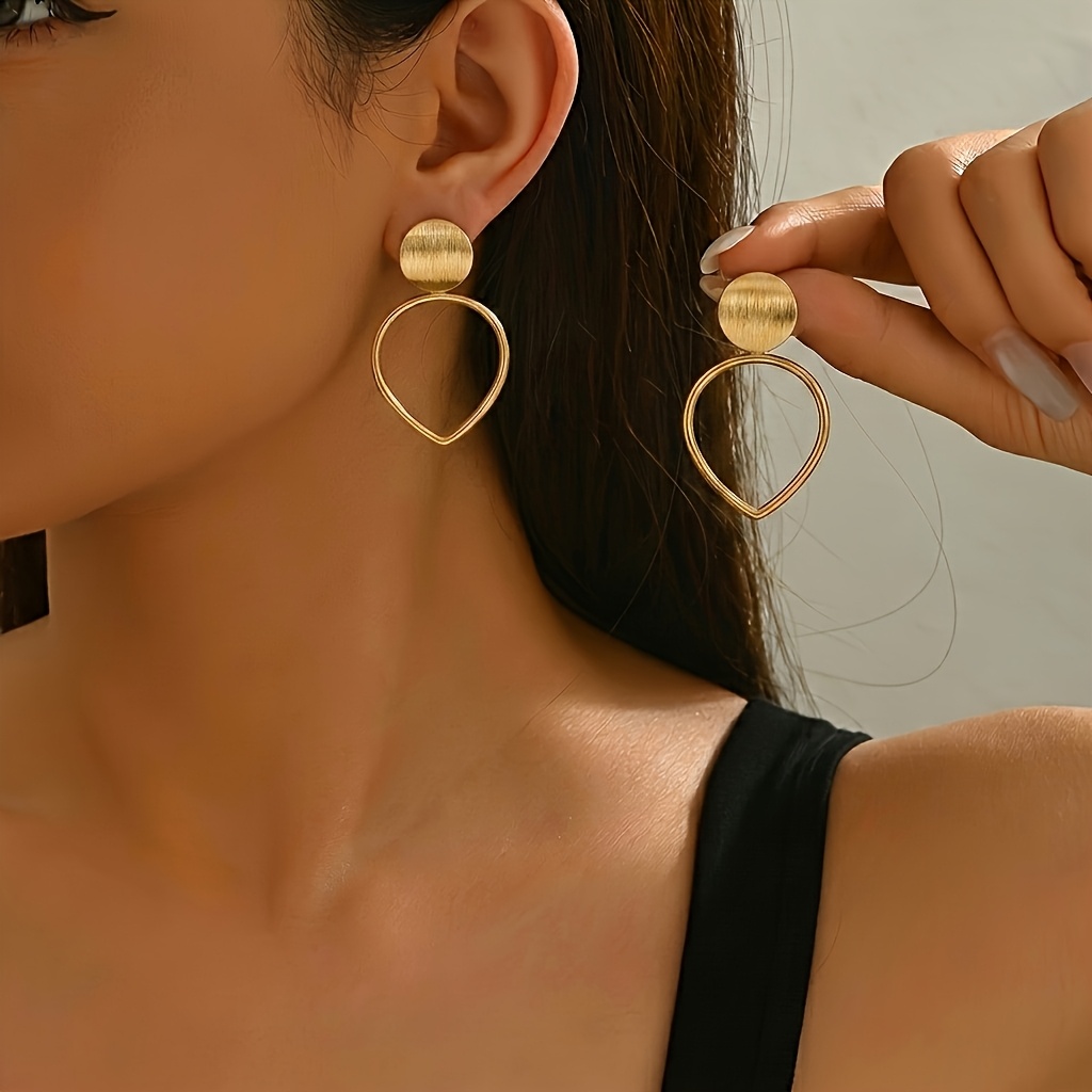 TEMU 1 Pair Of Golden Brushed Disc Teardrop Hollow-out Earrings, Minimalist . The Top Features A Brushed Disc To A Geometric Teardrop-shaped Frame