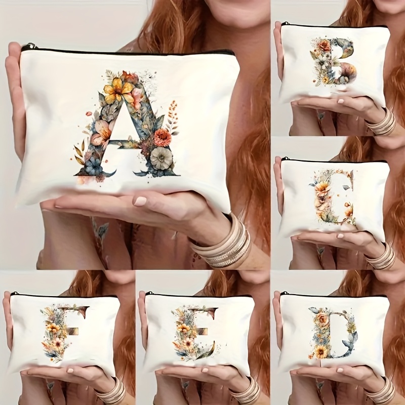 a beautiful floral makeup bag featuring the   of the alphabet   toiletries pens or as a gift bag an ideal present for mothers daughters   teachers   essential for graduation season  