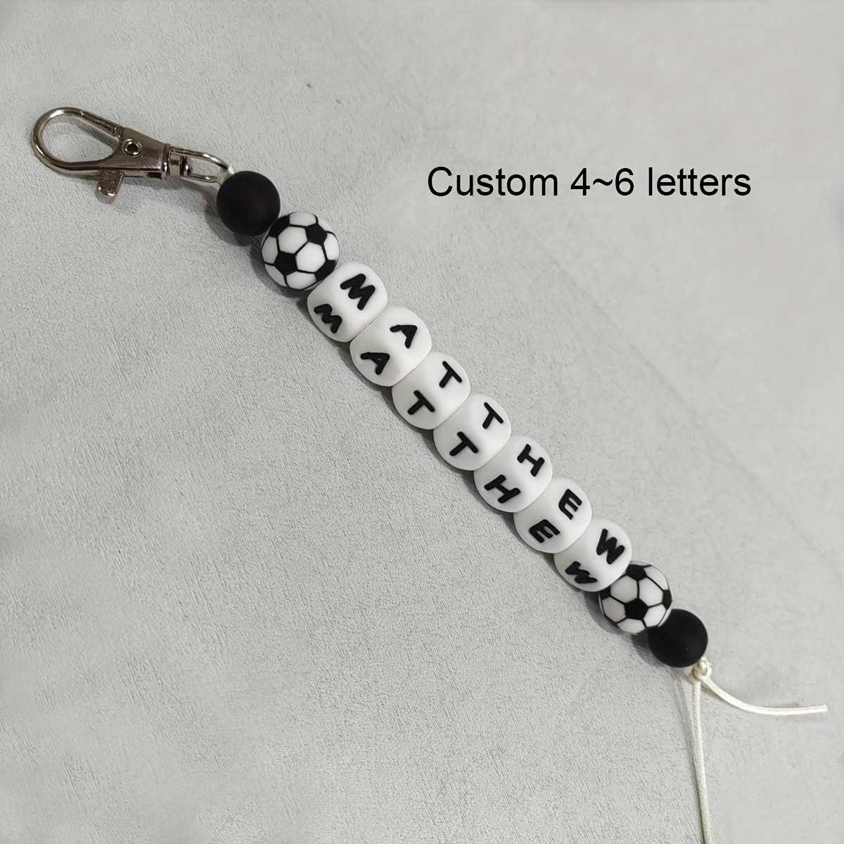 Image of Customizable Silicone Keychain With Personalized Name Beads - Sporty Design For Backpacks, Featuring Football, Basketball, Baseball, And Themes - Perfect For And. Suitable For Men And Women.