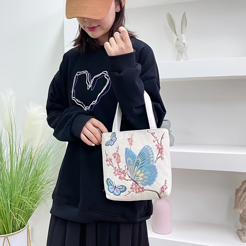 

Fashion Embroidered Butterfly Canvas Tote Bag, Stylish Lightweight Handbag, Casual Accessory With Floral Design, Durable Shopping Shoulder Bag