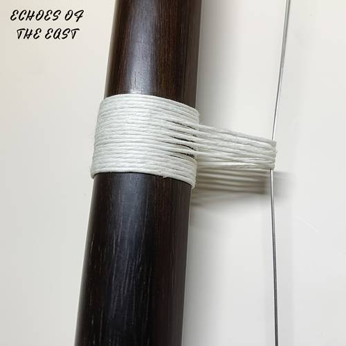 durable and adjustable nylon bridge cord for erhu designed to wear this waxed cord serves as a replacement for the erhu line offering high tensile strength and flexibility for effective tension ensures
