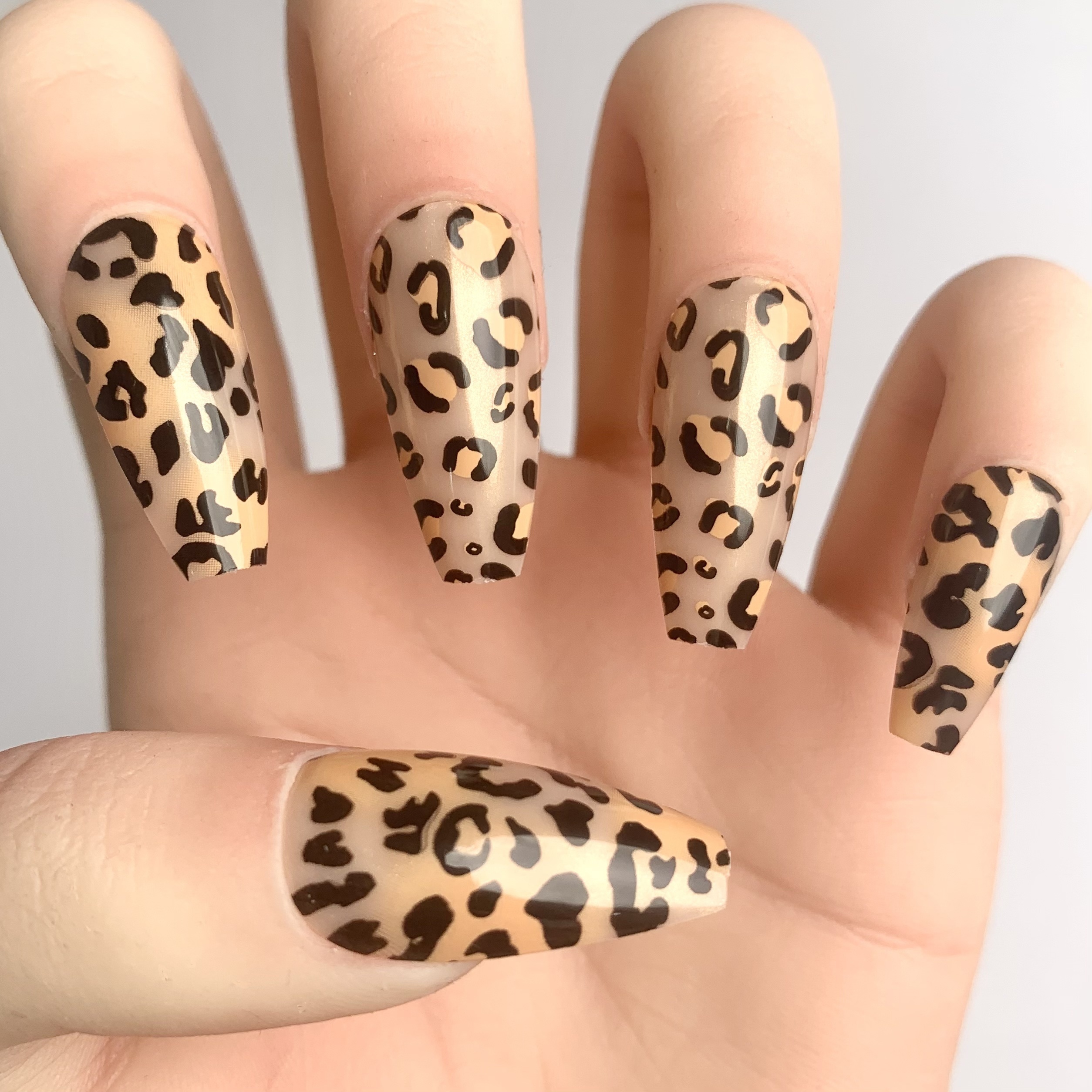 

Leopard Print Double Pack - Light Orange Swirls & Black Spots (2 Styles For Mix & Match) - 28 Pieces Long T-shape Press-on Nail Tips & 1 Buffing Strip & 1 Gel Top Coat - Casual Fashion & Animal