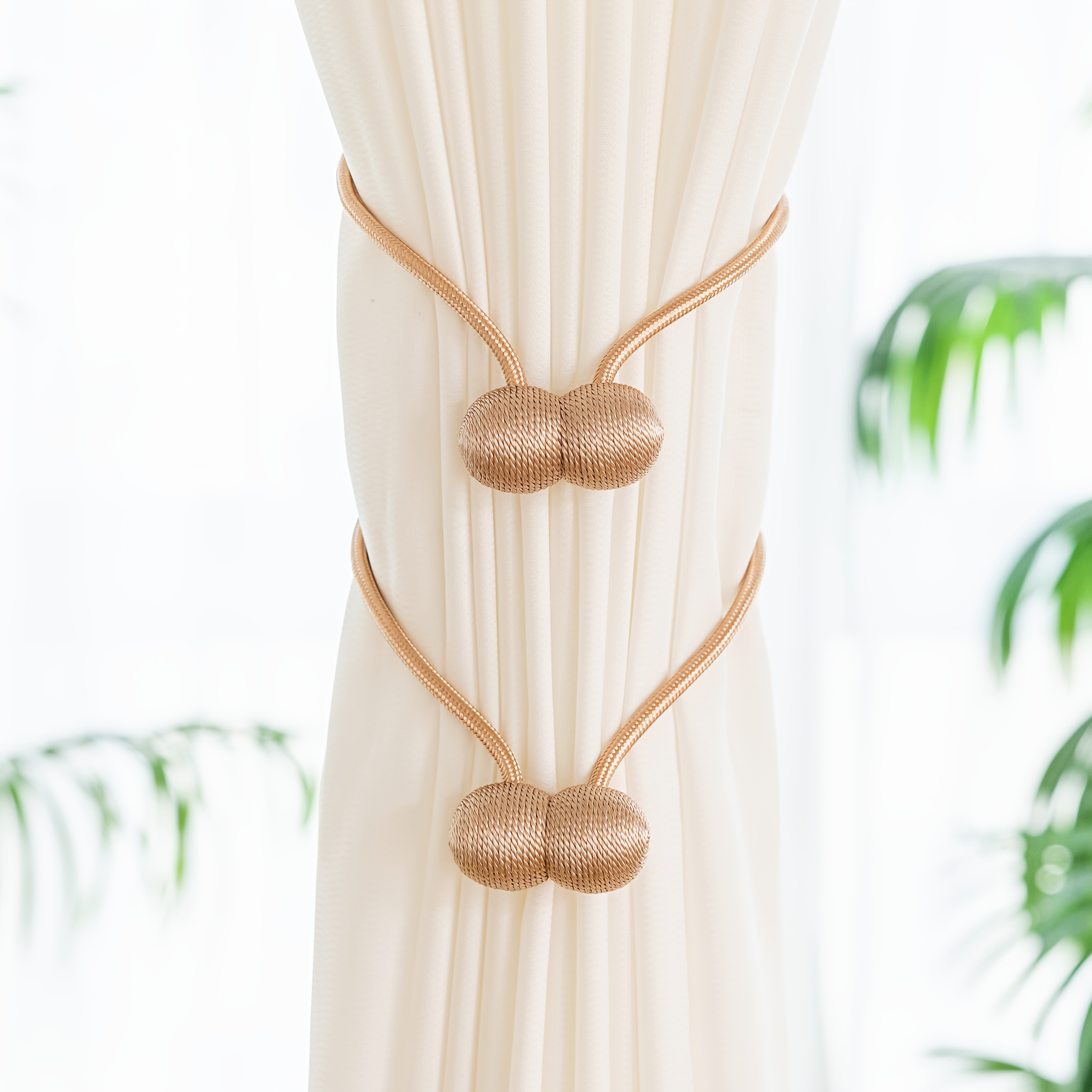 A Set of Two Modern Minimalist Magnetic Curtain Ties Is on, Featuring Thicker Twisted Ropes And Flexible Magnetic Ties. They Are Durable, Easy to Install, And Do Not Require Drilling, Making Them Perfect for Bedroom And Living Room Decor