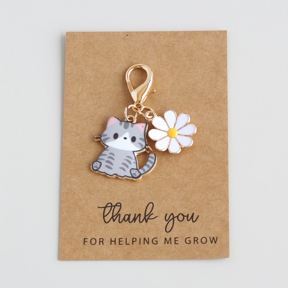 TEMU 1 llavero de esmalte con diseño de gato y margarita, dije dorado para bolso con tarjeta, regalo de agradecimiento al profesor, tirador de